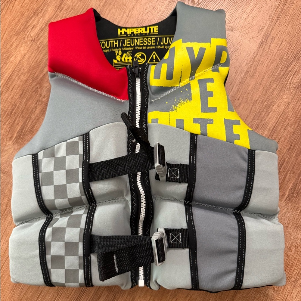 Gray and Red Life Vest with Adjustable Buckles and Checkered Detail